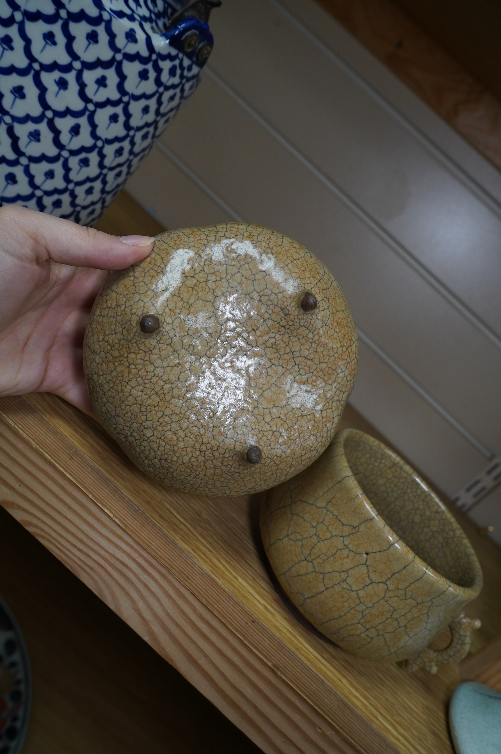 Two buff coloured crackle glazed censers including a tripod example, largest 17cm wide. Condition - good